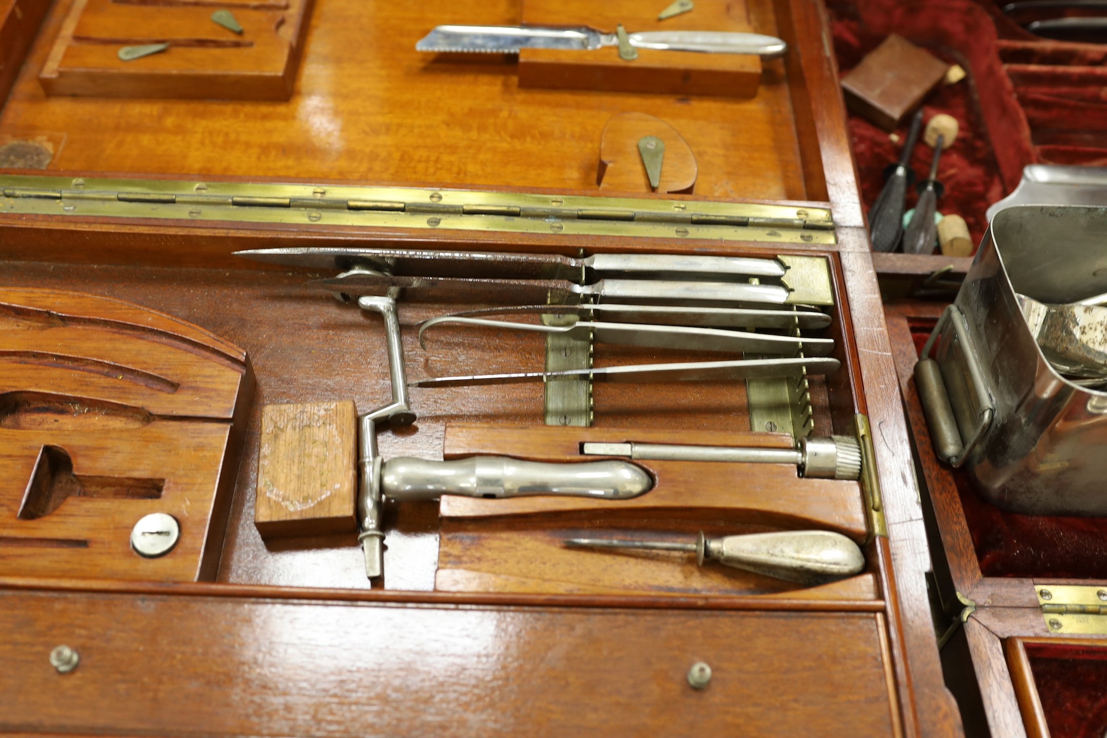 A 19th century mahogany cased field surgeon’s set (incomplete), and other field medical equipment, all three in brass banded mahogany boxes